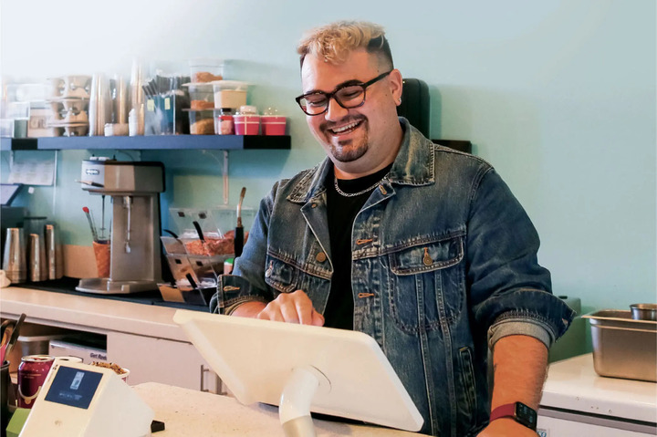 Restaurant owner using Clover POS